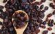 Raisins on a wooden spoon